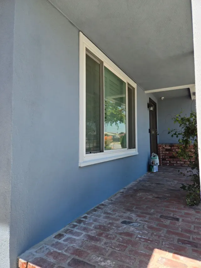 Electrical in Torrance: the finished side wall and brick walk of the home