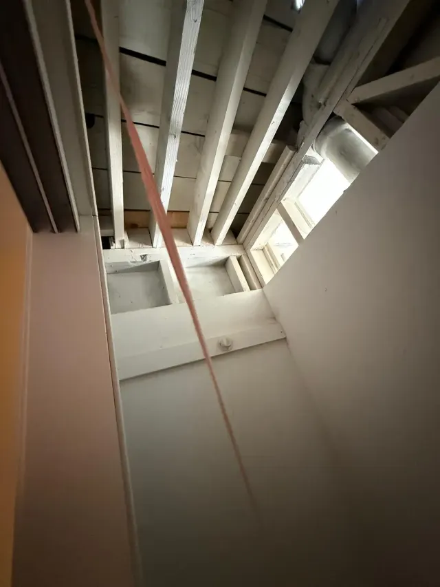 Mold remediation in Van Nuys: a ceiling opened up to the joists, with an air duct running above