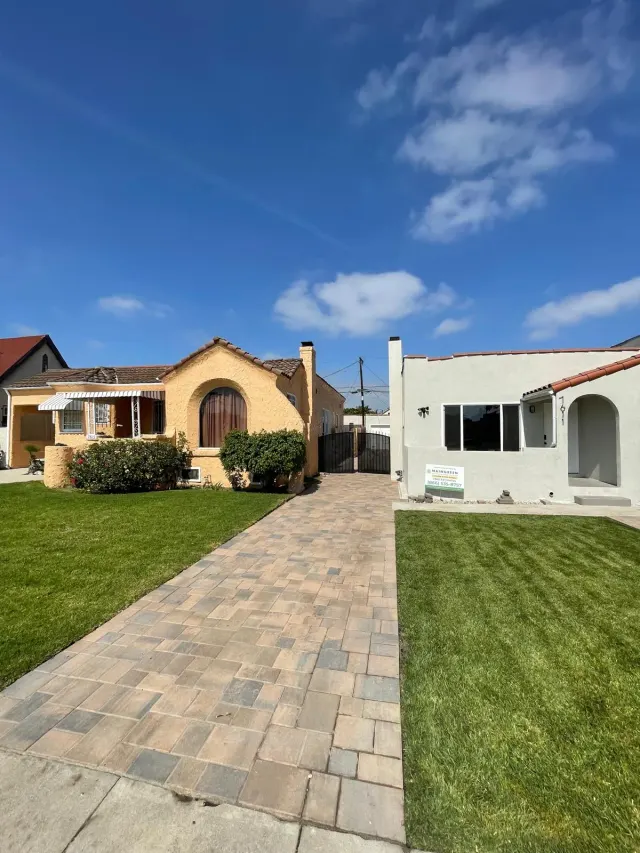 Paver walkway beside a new lawn at a Los Angeles home