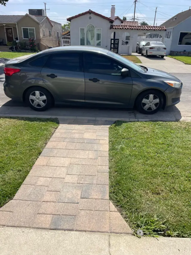 Outdoor and landscape in Los Angeles: a paver walkway from the sidewalk to the house through a new lawn
