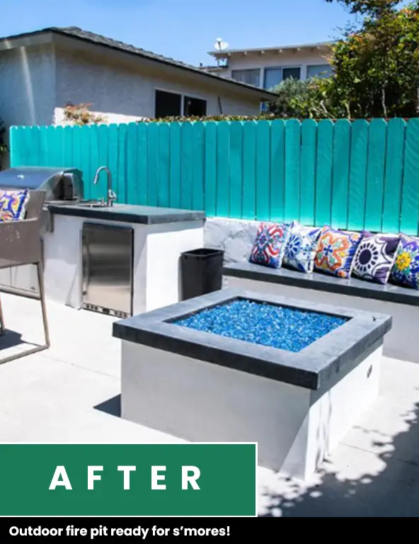 After photo: fire pit with blue fire glass next to a built-in barbecue and a bench